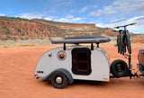 This Utah Teardrop RV rental: 'Jack,' a compact trailer with bikes attached, is set for red rock desert adventures.