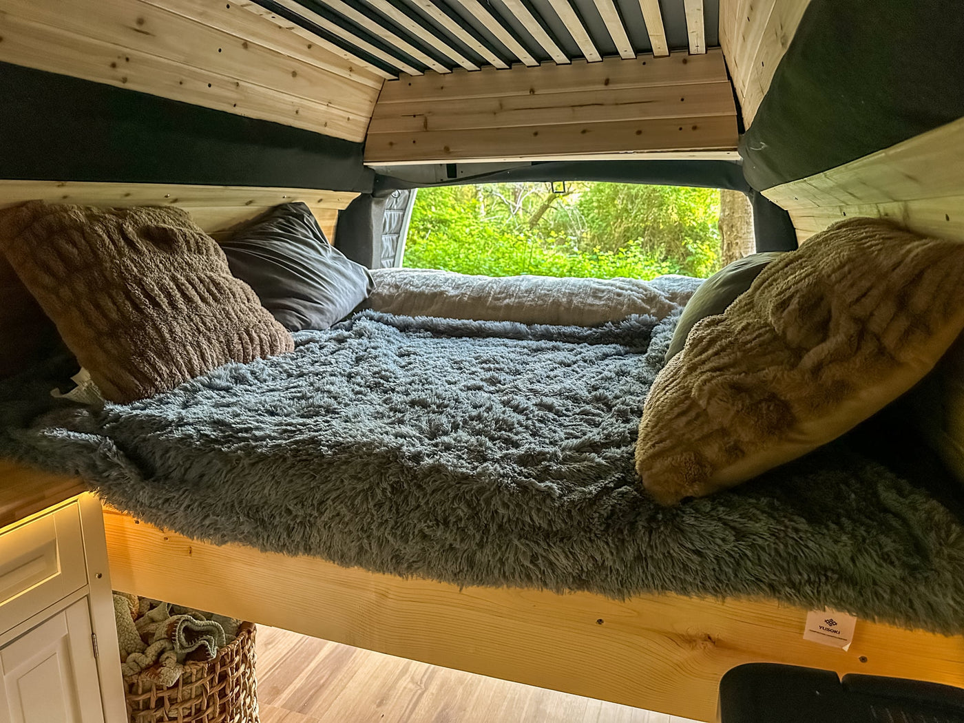  and camera for your next road trip adventure.|Cozy RV rental interior featuring a wood-paneled ceiling and walls — photo 4