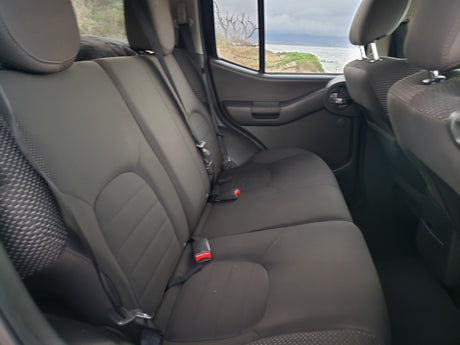 Dark grey vehicle rear seats with coastal view. Great for your next RV rental adventure.