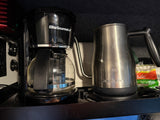Elite Gourmet coffee maker and Bodum electric kettle in an rv rental setup, ready for brewing.