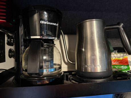 Elite Gourmet coffee maker and Bodum electric kettle in an rv rental setup, ready for brewing.