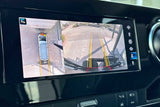RV rental's 360-degree camera display for parking assist. Split screen shows overhead virtual view and rear camera.