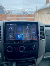 RV rental: Dashboard with Boss Elite Apple CarPlay screen & climate controls. Snowy neighborhood visible outside.