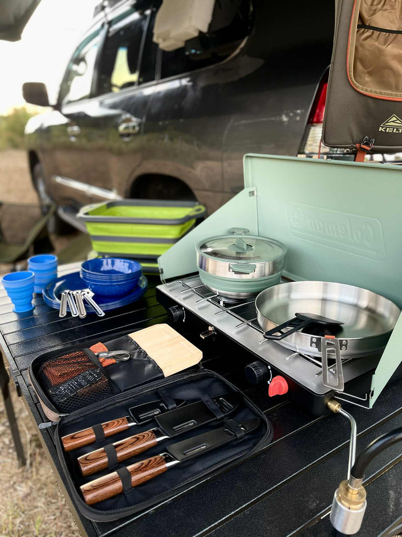 RV rental adventure: complete portable kitchen setup with stove, dishes, and knives for outdoor cooking. — photo 6