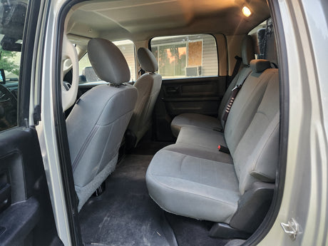 Interior of a large vehicle for RV rental. Shows spacious rear seating and clean passenger cabin ready for travel.
