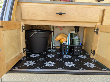  is ready for your next rv rental adventure in a scenic outdoor setting.|Compact rv rental teardrop camper kitchen featuring a sink