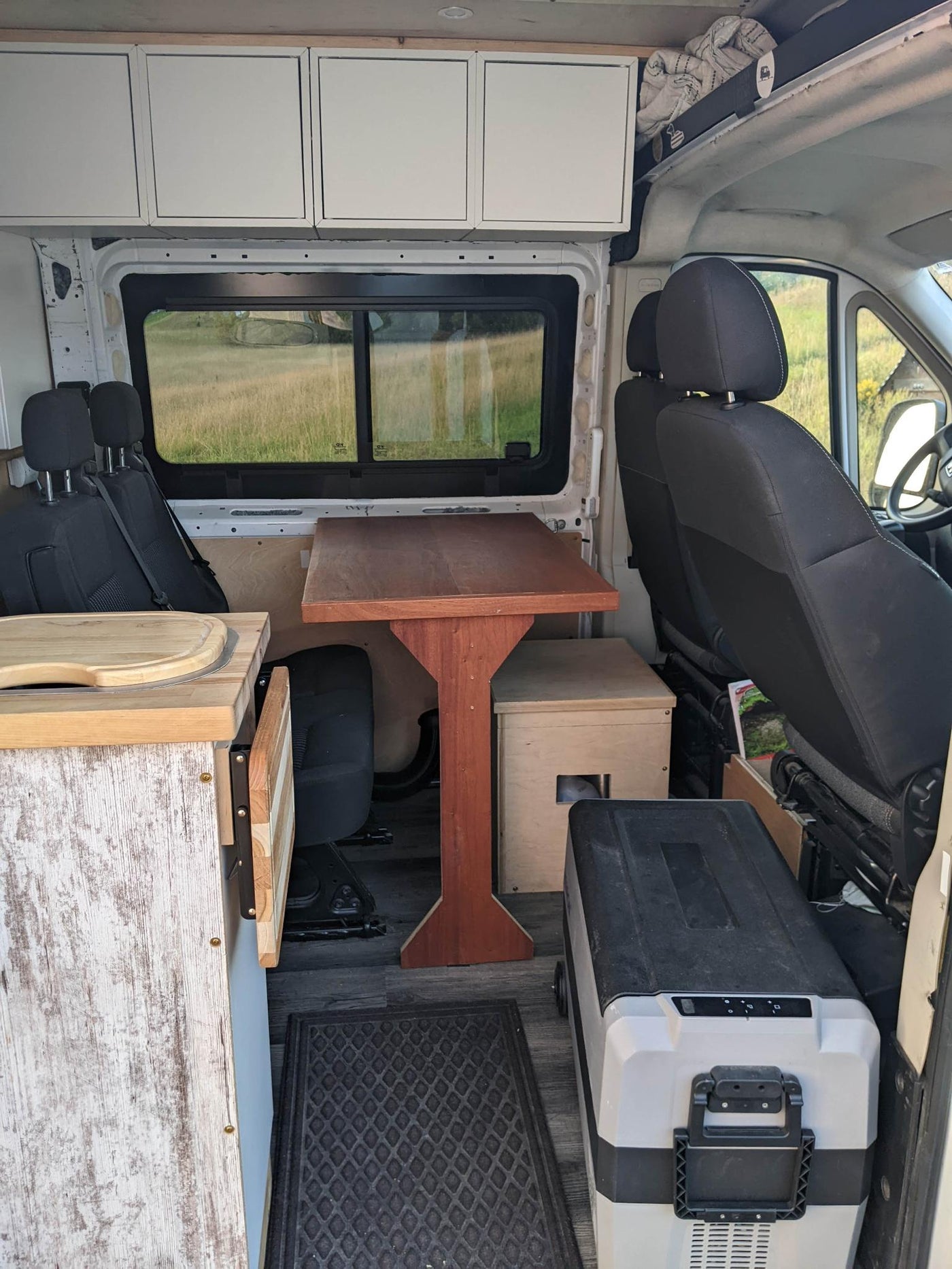  and functional pegboards.|This cozy **rv rental** offers a custom wood interior with kitchen — photo 9