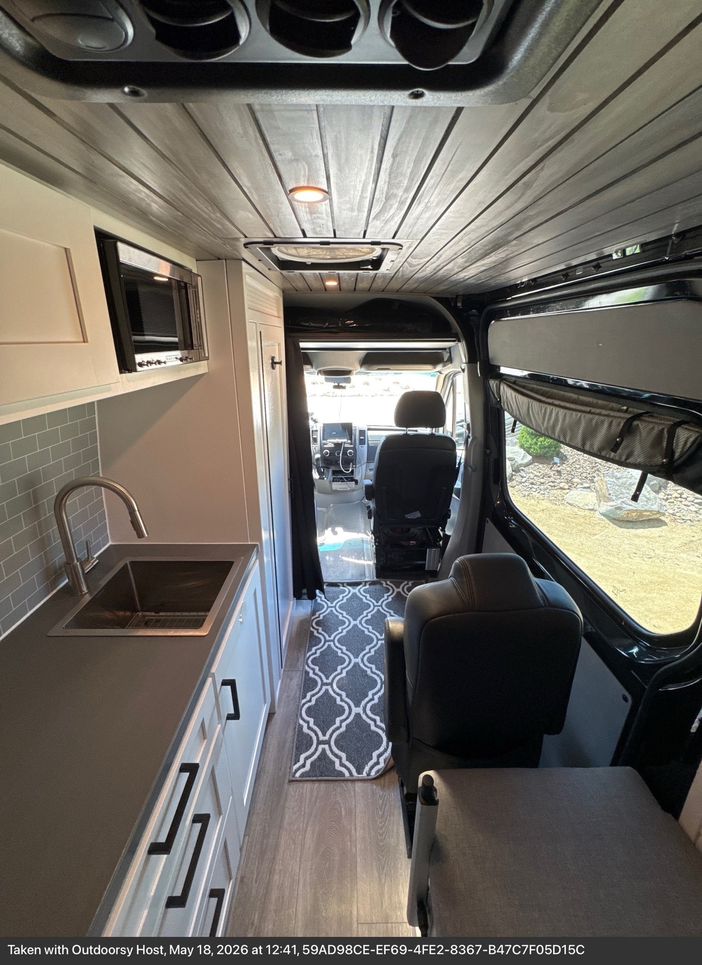  and cozy bench seating.|Inside a modern rv rental camper van — photo 4