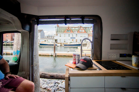 Experience coastal living in an RV rental: scenic harbor views, a fully equipped kitchen, and comfy seating.