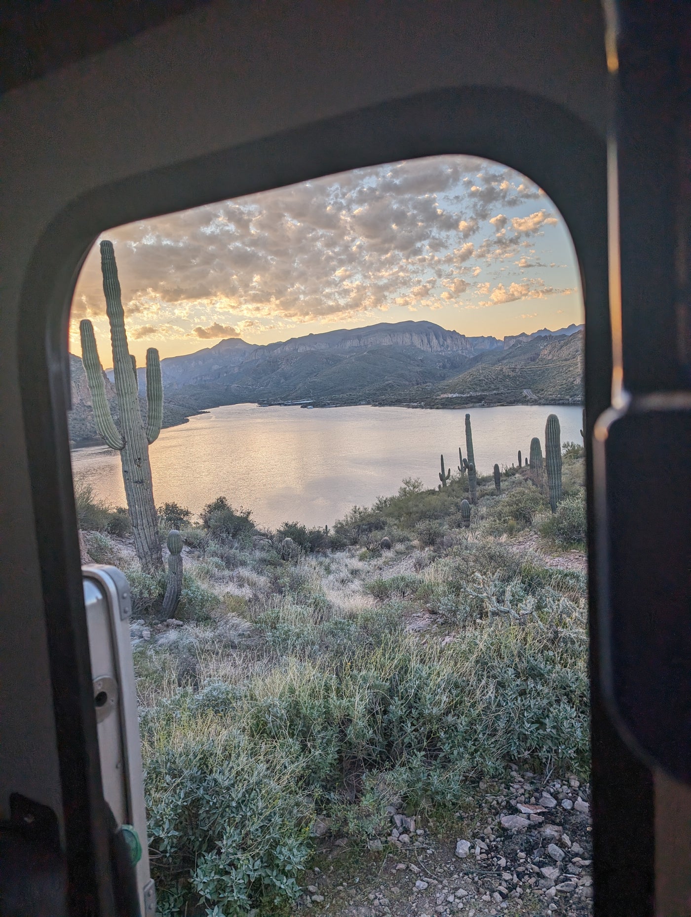 Stunning desert sunset from an RV rental, featuring saguaros, mountains, and a serene lake. — photo 15