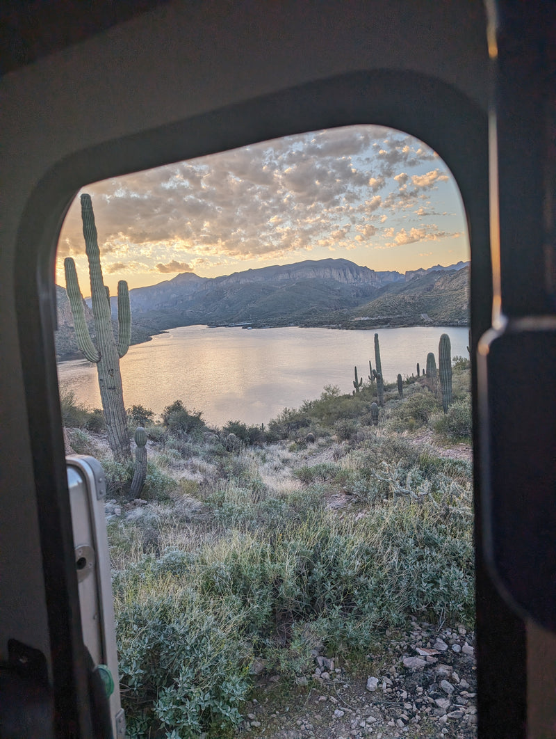 Stunning desert sunset from an RV rental, featuring saguaros, mountains, and a serene lake. — photo 15
