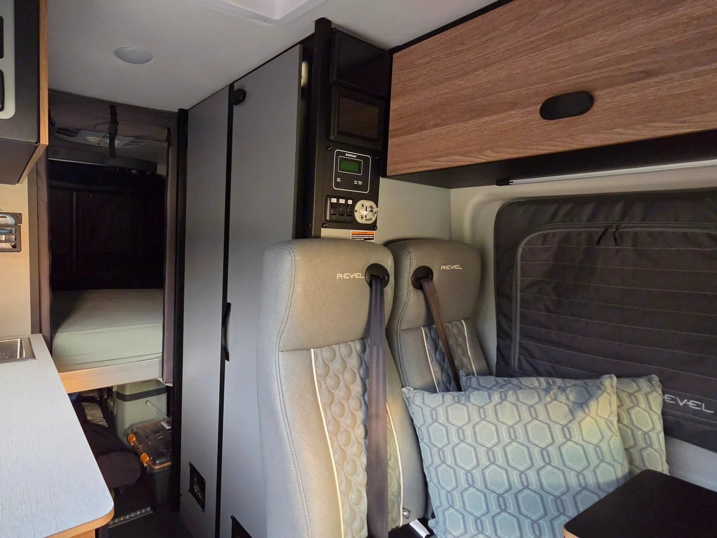  & a compact wet bath with toilet.|Modern rv rental camper van interior: kitchen — photo 10