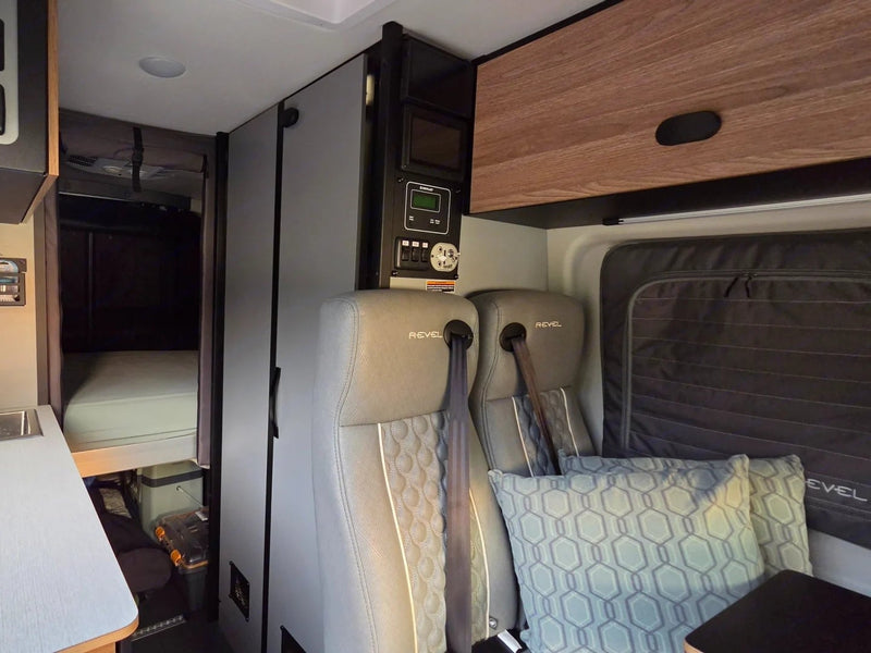  & a compact wet bath with toilet.|Modern rv rental camper van interior: kitchen — photo 10