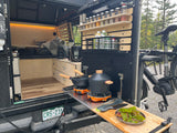 RV rental adventure! Cozy sleeping area and well-equipped mobile kitchen for camp cooking & outdoor living, complete with bike.
