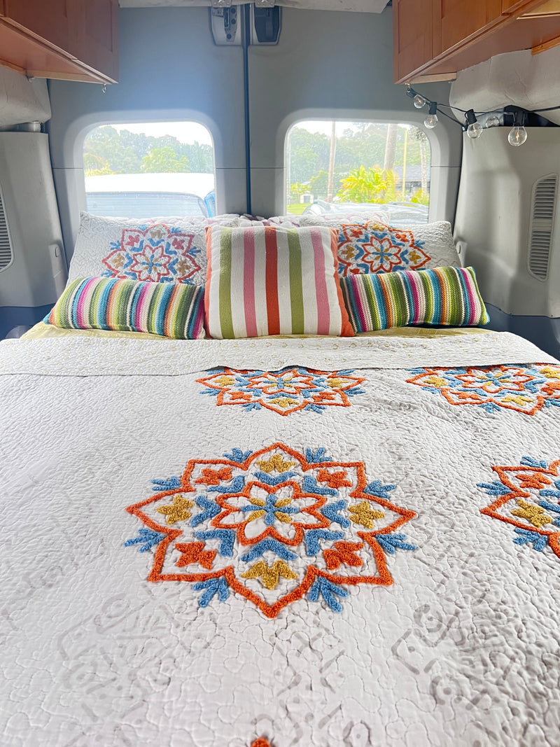  and string lights.|Cozy RV rental interior: colorful bed — photo 3