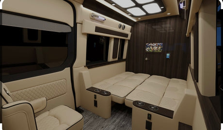 Explore this luxurious RV rental interior: spacious seating that converts to beds, large windows, TV, and sleek wood accents.