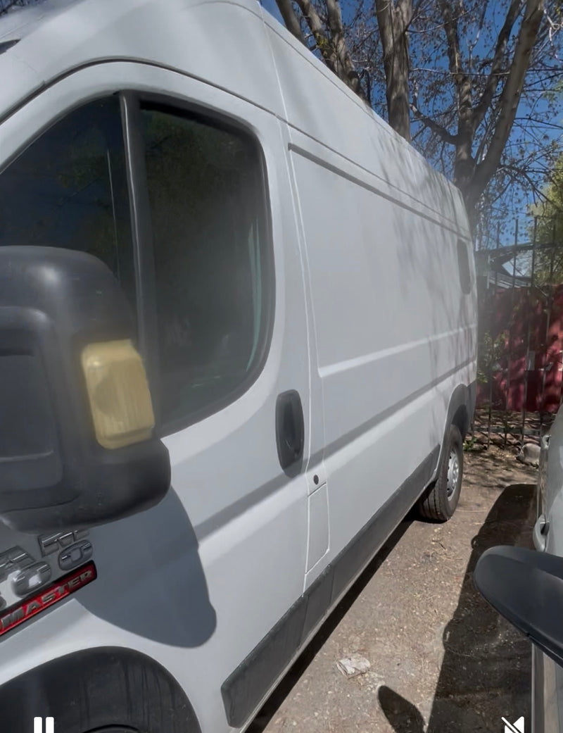  cloudy sky.|A white Ram ProMaster 1500 van — photo 5
