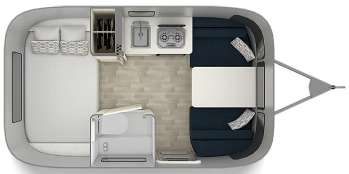  and a window with white curtains.|Explore the compact and efficient bathroom setup in this RV rental