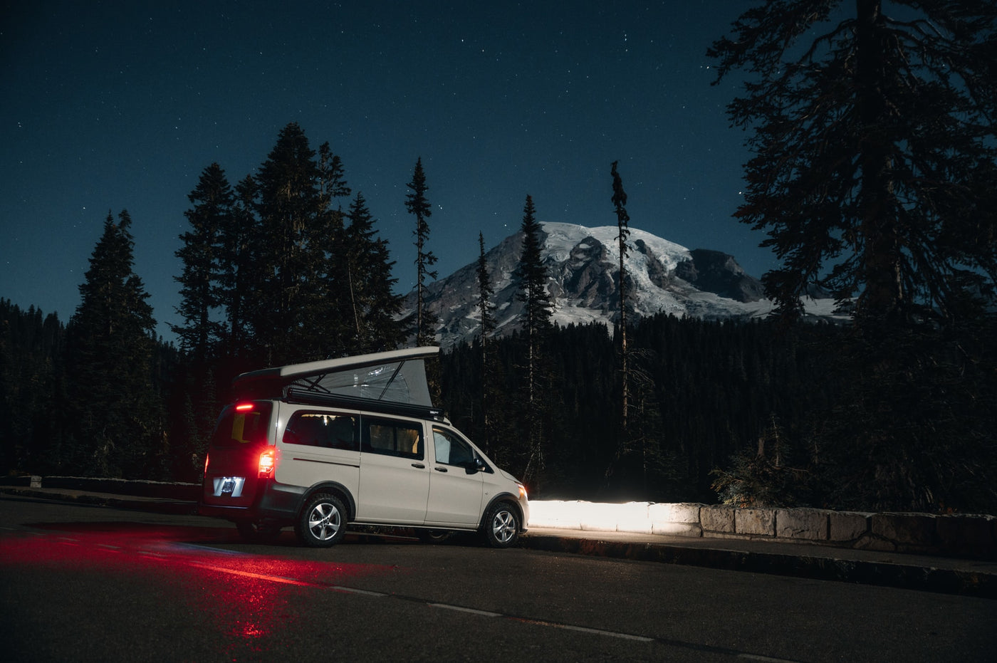  and a car seat.|A man works on his tablet inside a modern rv rental — photo 17