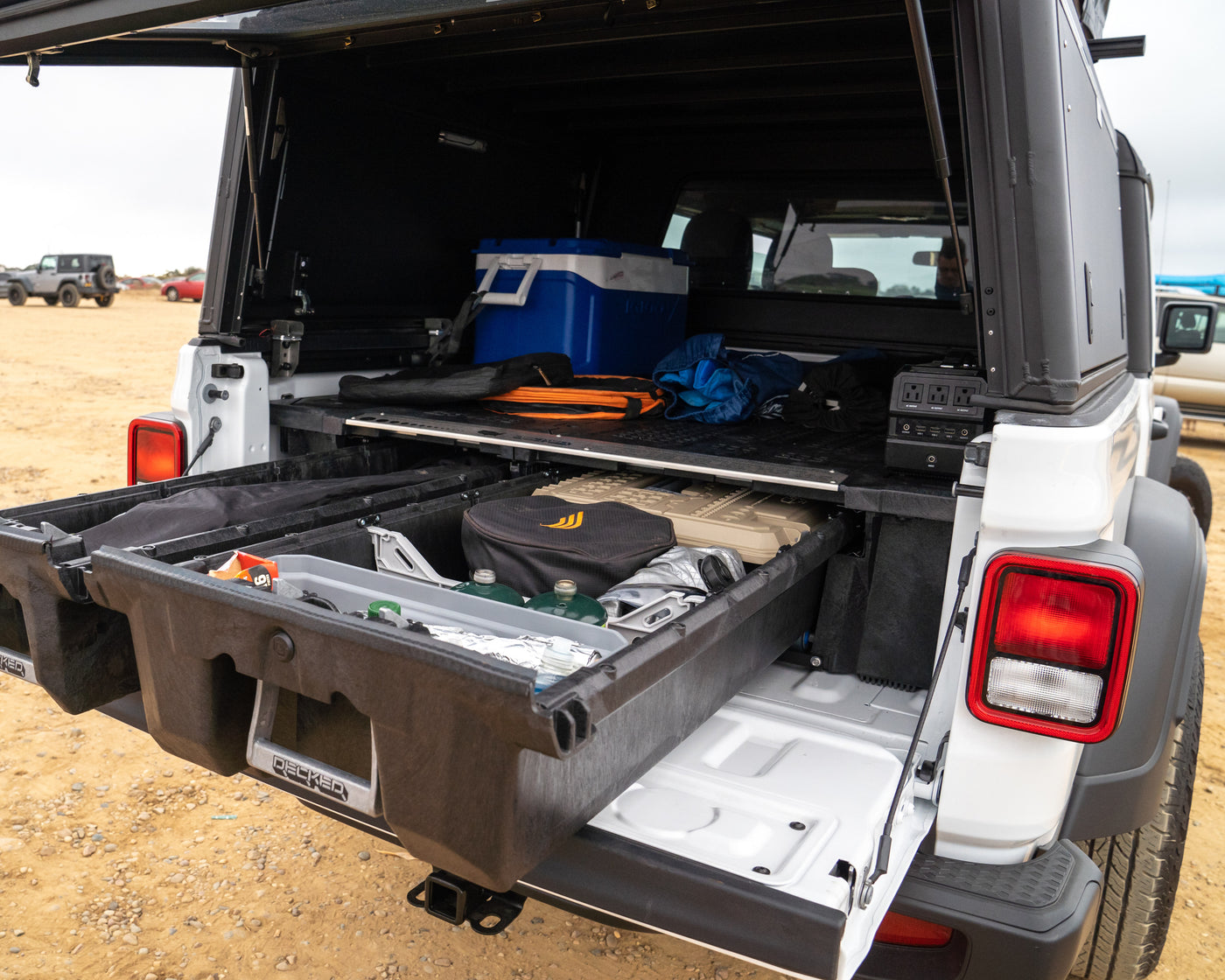 Jeep Gladiator truck bed with DECKED storage drawers, cooler, and power station, ideal for organized overlanding or rv rental. — photo 6