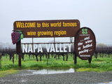 Welcome to Napa Valley sign & vineyard on a wet day. An rv rental trip explores this world-famous wine region.