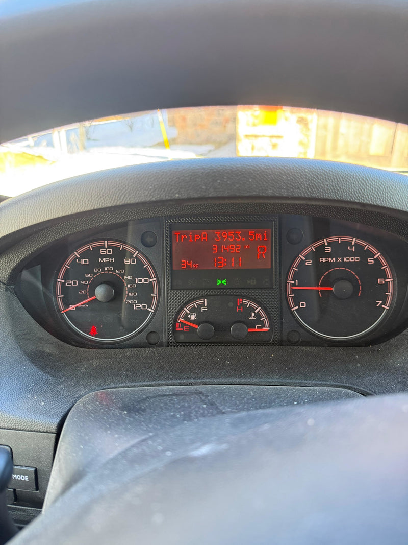 RV rental dashboard: 31,492 miles, 34°F, 1:11 PM. Fuel low, seatbelt light on a dusty vehicle panel. — photo 16