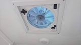 RV rental interior: A white ceiling features a large vent fan with mesh screen, fan speed dial, and directional switch.