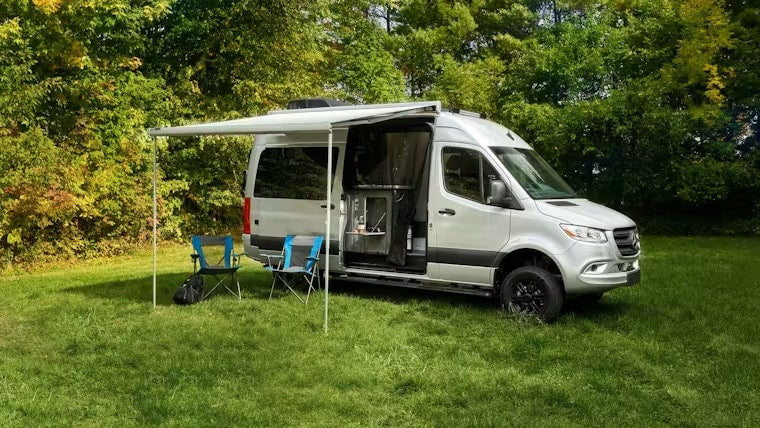  & swivel chairs. Plan your adventure!|Inside a modern RV rental: a gray camper van interior with a dinette — photo 8