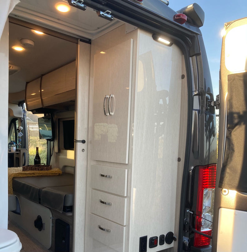  and the driver's cockpit.|Inside a comfy RV rental: dual beds — photo 9