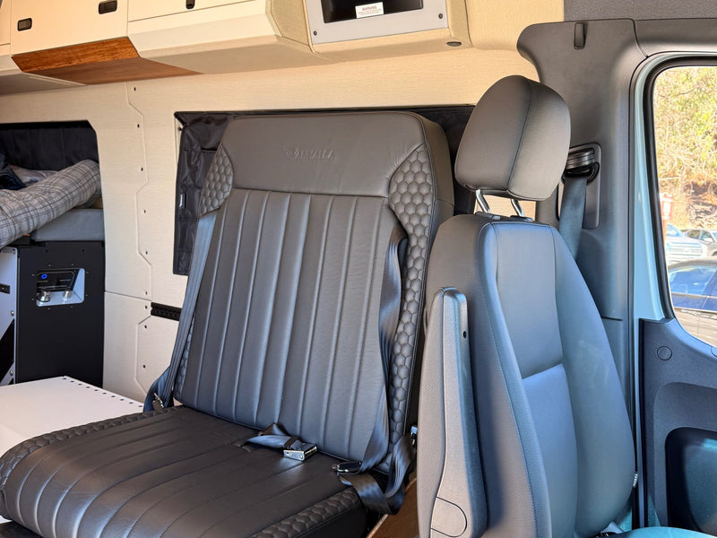  quilted captain's seat and personal cargo.|Experience comfort in this RV rental's custom interior — photo 20