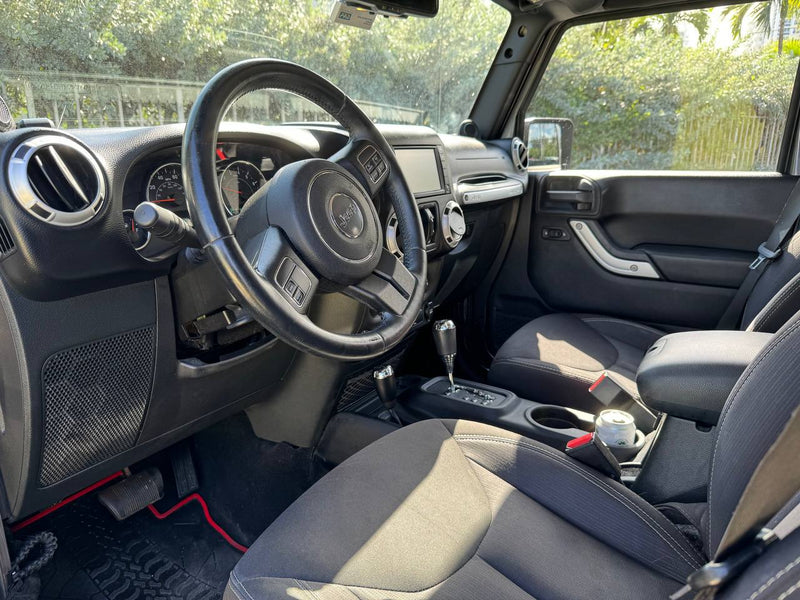 Clean Jeep interior with automatic shifter and black seats, great for your next rv rental adventure. — photo 17