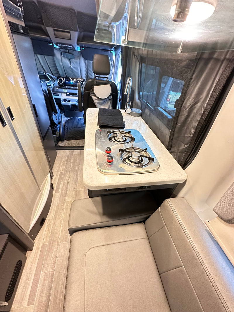  perfect for mobile living.|Inside an RV rental: a compact wet bath with a toilet — photo 7