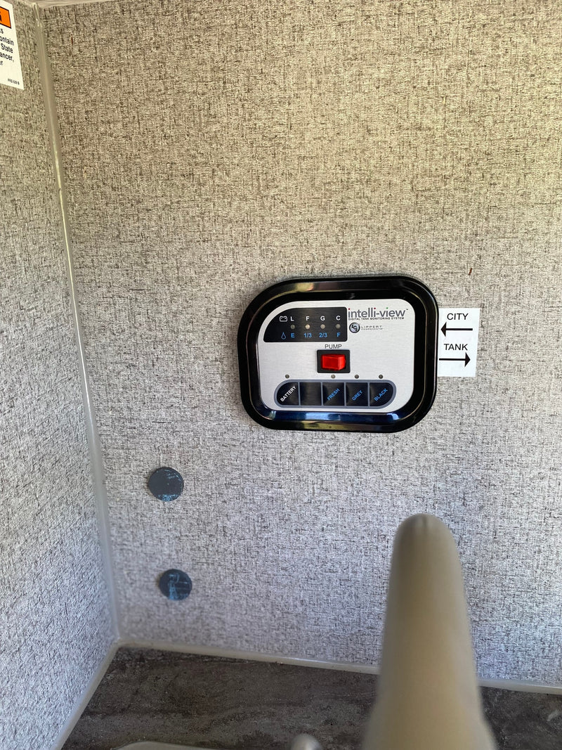 Control panel inside an RV rental: an Intelli-view digital tank monitoring system for battery and water levels. — photo 10