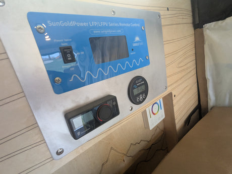 RV rental control panel: SunGoldPower inverter, Victron battery monitor, Eberspächer heater, and LED light controls.