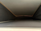 RV rental: Pop-top camper's cozy elevated sleeping area with ambient LED lighting and dark fabric walls.