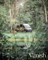 Explore nature with this tan camper van rv rental parked by a reflective pond in a tranquil forest.