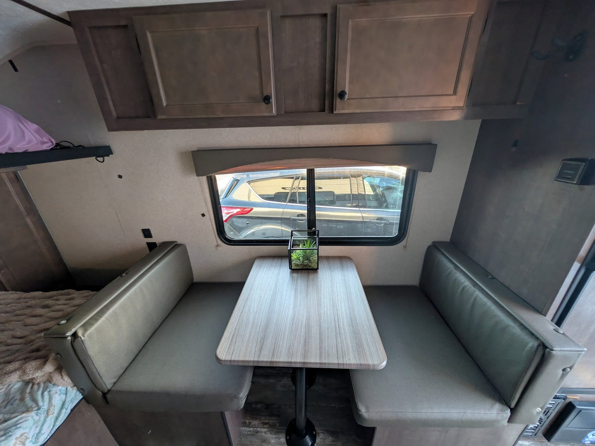  & sleeping zones.|This RV rental interior features a compact kitchen — photo 4
