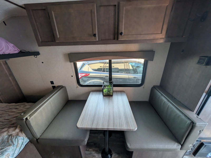  & sleeping zones.|This RV rental interior features a compact kitchen — photo 4