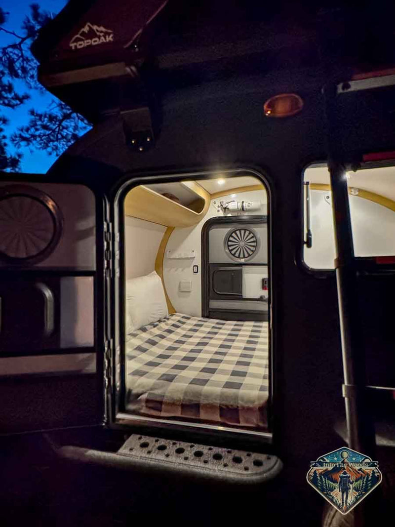  and compact design.|Cozy RV rental interior: a comfortable bed — photo 4