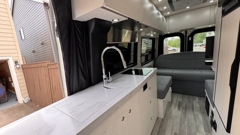  and a sleek kitchen.|RV rental: Modern — photo 12