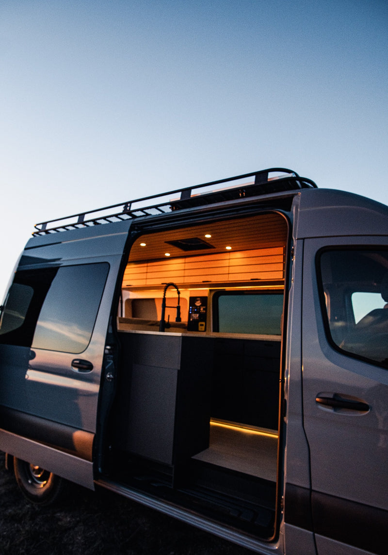  and overhead lighting.|Cozy RV rental interior: light wood paneling — photo 4
