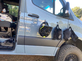 RV rental van displaying a bike helmet & protective pads on magnetic hooks, ready for outdoor adventure.