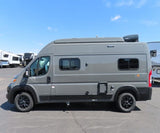 Side view of a modern grey Winnebago Solis campervan for RV rental, parked outdoors. Perfect for your next adventure.