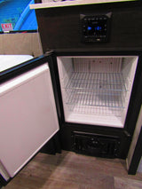 Explore your rv rental's interior: an open built-in mini-fridge with shelves, and a control panel displaying AM 11:01.