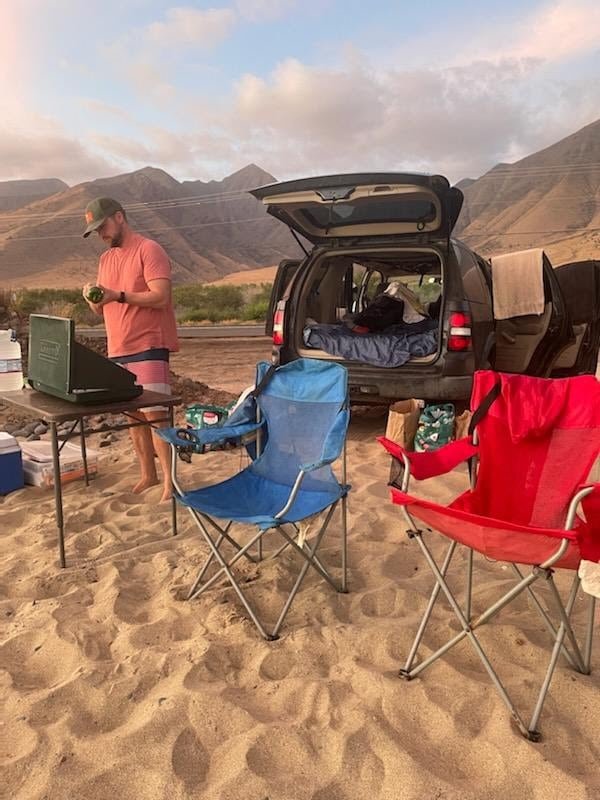  like an RV rental!|Happy woman enjoys her SUV converted for car camping. A comfy — photo 6
