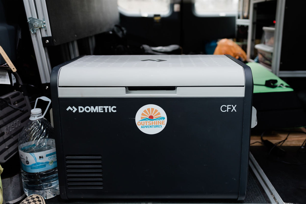  a comfy bed with patterned linens holds pillows reading 'SHINE ON' and 'Life is a beautiful ride.'|Cozy and functional camper van bed setup — photo 13