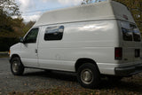 White high-top van with 'Bel-Air' script, perfect for your next rv rental adventure.