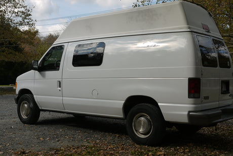 White high-top van with 'Bel-Air' script, perfect for your next rv rental adventure.