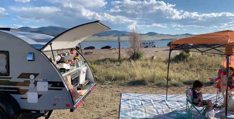  complete with paddleboards for water fun!|Cozy RV rental interior with a comfy bed — photo 1