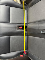 Measuring vehicle rear seat length (approx. 29+ inches) for an RV rental. Provides key dimensions for space planning.